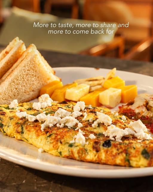 Herb omelette with feta, toast and mango